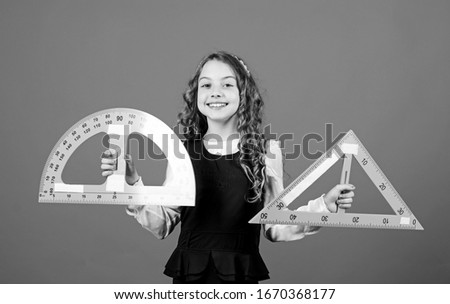 Learn mathematics. Theorems and axioms. Smart and clever concept. Sizing and measuring. Girl with big ruler. School student study geometry. Kid school uniform hold ruler. School education concept.