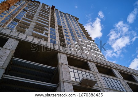 Construction site. High rise Building under construction. Construction of high-rise residential building