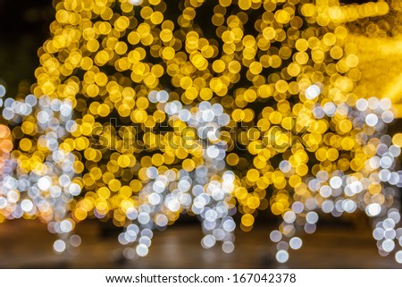 Abstract background with a deer bokeh defocused colorful lights - picture of the Christmas tree ornament.