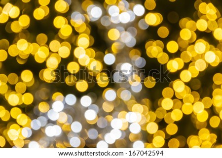 Abstract background with a deer bokeh defocused colorful lights - picture of the Christmas tree ornament..