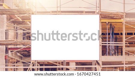 construction site with scaffold with information signage mock-up