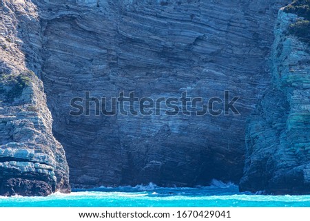 Natural beauty of rocky formation and isolated beaches in Mediterranean islands in Greece - Seascape background scenery with deep blue sea and beautiful Mediterranean colors