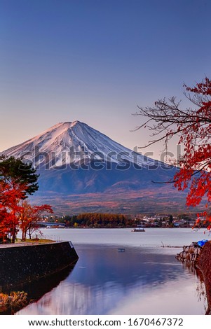 Japan and Asian Travel Destinations. Fuji Mountain in Kawaguchiko in Japan With Seasonal Red Maples in Foreground. Picture Taken At Fall. Vertical image