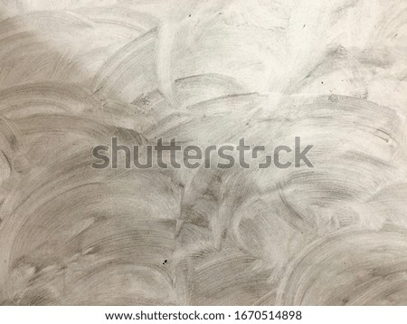 Two shades grunge concrete wall with brush strokes textured and stained