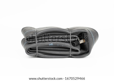 Inner tube part for motorcycle bike isolated on white background , repairman used to repair motorcycle leaking tires.