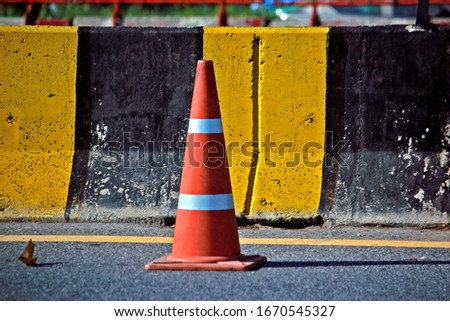 Detail of a road cone near the road