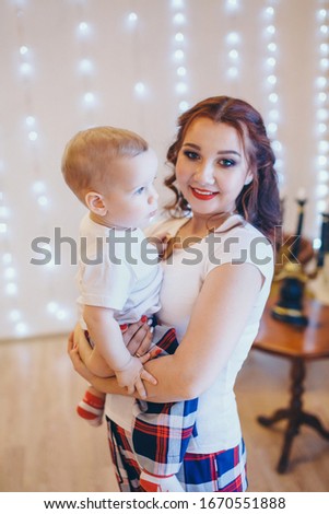 the concept of a healthy lifestyle, the protection of children, shopping - baby in the arms of the mother. Woman holding a child. Copy space