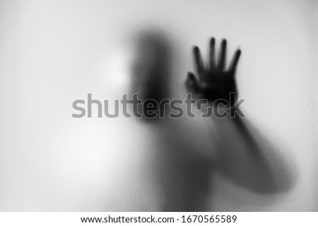 Shadow blur of man wear mask to prevent infection background.Fight against communicable diseases covid-19.Black and white picture.Blur picture.Fight deadly communicable diseases coronavirus.Soft focus