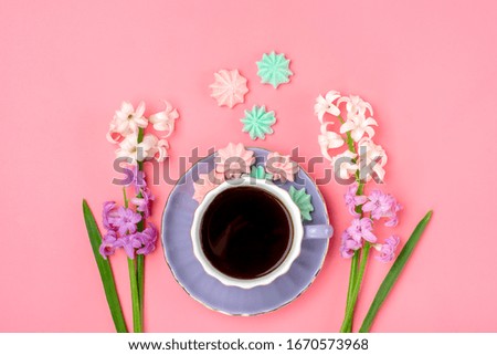 lilac cup with coffee, meringue, bouquet of hyacinths flowers on pink background Flat lay Top view Hello spring, good morning concept