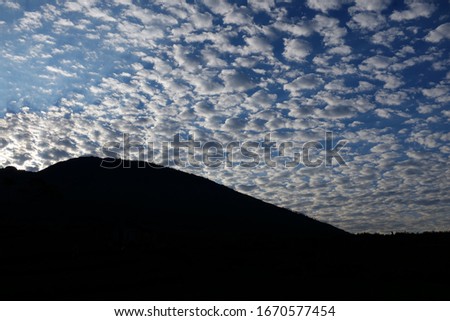 silhouette of a mountain with a beautiful morning sky background
