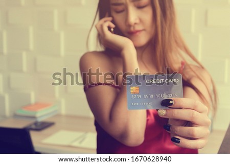 Unhappy of business woman Holding of Credit Cards background textures.