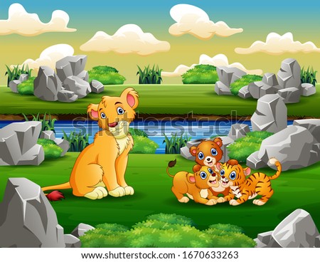 Wild animal family playing at riverbank
