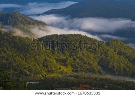 Morning landscape with mountains and mist at Dalat highland, Vietnam 