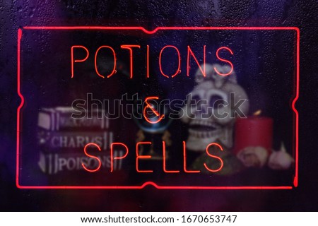 Potions and Spells Neon Sign in Rainy Window