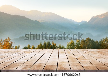 Wooden table terrace with Morning fresh atmosphere nature landscape Royalty-Free Stock Photo #1670662063
