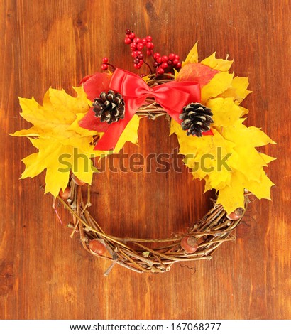 Beautiful Thanksgiving wreath, on wooden background
