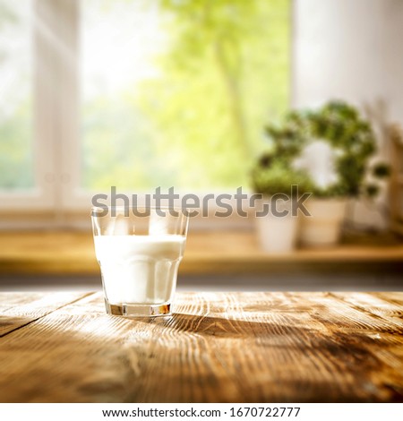 Table background of free space and blurred window in home inerior 