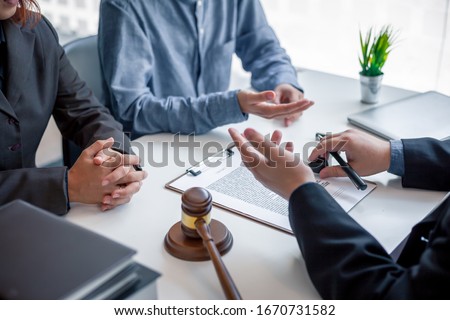 Businessman and lawyer discuss the contract document. Treaty of the law. Sign a contract business. Royalty-Free Stock Photo #1670731582