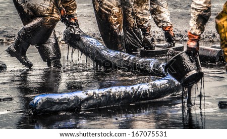 oil spill cleanup at koh samet thailand Royalty-Free Stock Photo #167075531