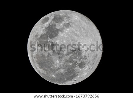 Full moon stack dark night sky. The full moon is lunar phase when It appears fully illuminated from Earth's perspective. It occurs when Earth is located between Sun and Moon appears as a circular disk