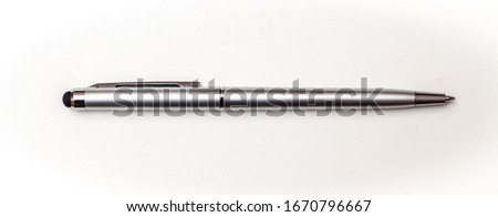 Flat lay of silver steel pen close up Royalty-Free Stock Photo #1670796667