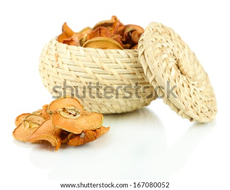 Dried apples in wicker basket, isolated on white