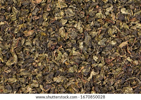 A green tea texture, background, pattern. Pile of green tea.