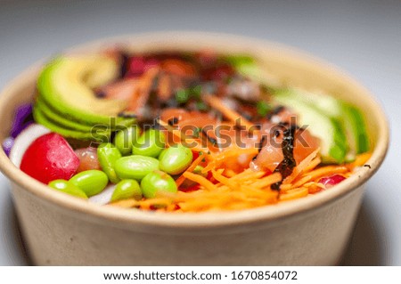 Salmon poke bowl n isolated background. closeup view