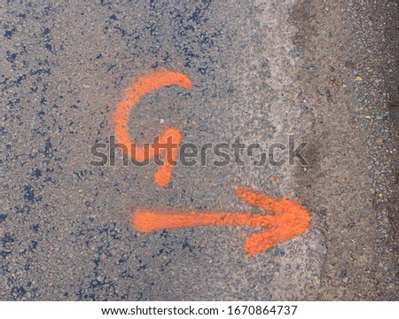 Spray painted markings left on road by contractors for future roadworks