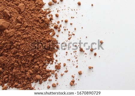 cocoa powder on a white background
