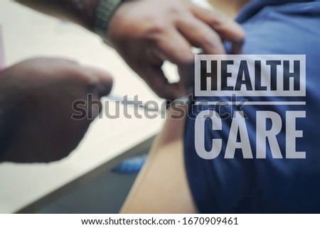 HEALTH CARE quote with blurred background, patient is receiving treatment at the hospital