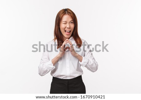 Portrait of smart and creative female asian manager, have evil plan, steeple fingers like genius and grimacing with pleased sly smile, scheming, have perfect idea, white background