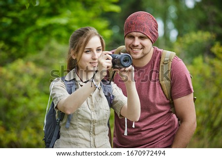 traveling couple in the forest