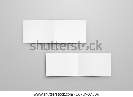 Mockup of two horizontal open bifolds with realistic shadows. White blank brochure for design presentation. Business booklet template isolated on gray background. Royalty-Free Stock Photo #1670987536