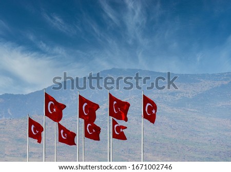 Many Turkish flag with poles waving front of clouds. Background.