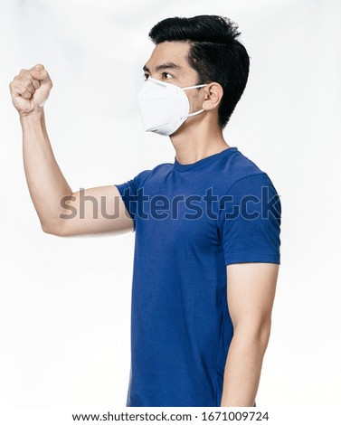 "FIGHT COVID-19" Coronavirus portrait handsome young asian 
man wearing mask protection from covid 19  isolated on white background in studio. Asian man people. COVID-19 concept.