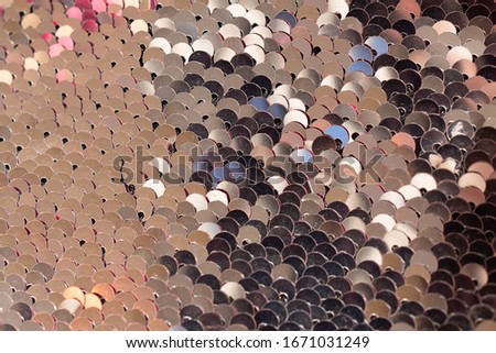 Close shiny background of silver sequins. glamorous background