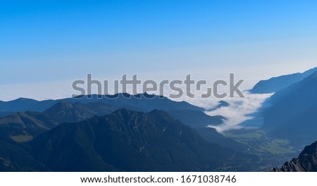 Picture of a foggy valley taken at the top of the Zugspitze