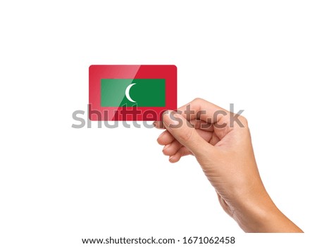 Beautiful hand holding Maldives flag card with white background 