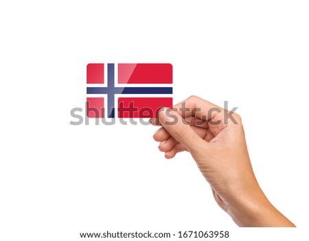 Beautiful hand holding Norway flag card with white background 