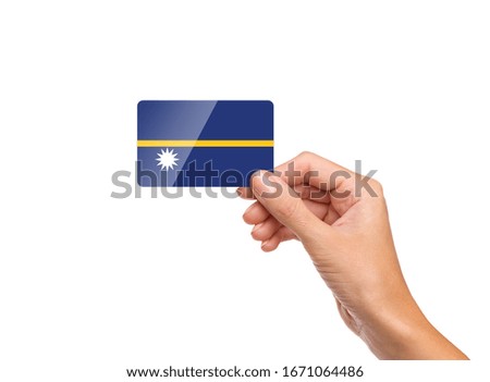 Beautiful hand holding Nauru flag card with white background 