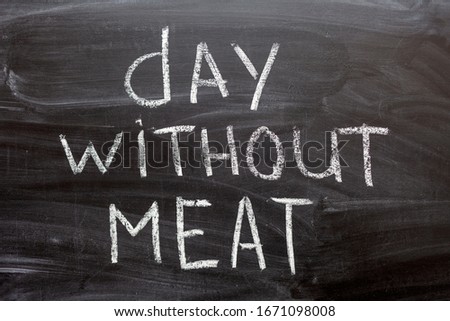 holiday international day without meat. Handwritten text on a chalkboard..