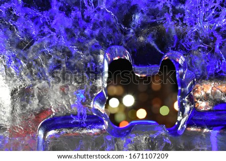 Ice texture in blue tones with lights in the hole.