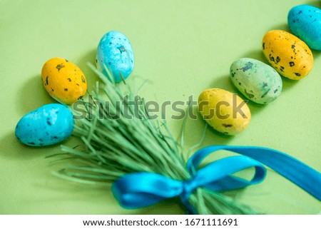 colored eggs, easter concept, green background. Grass paper background. Spring april greeting card