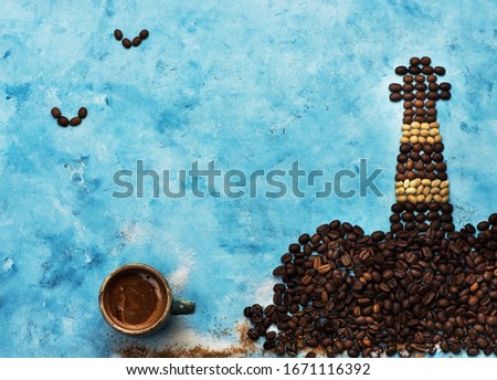 Creative art background Cup coffee and coffee beans. Postcard made of coffee beans.