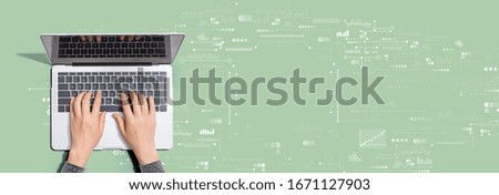 Technology screen with person using a laptop computer
