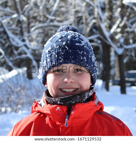 portrait of a happy boy in winter