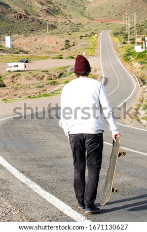 long road skating between wild mountains