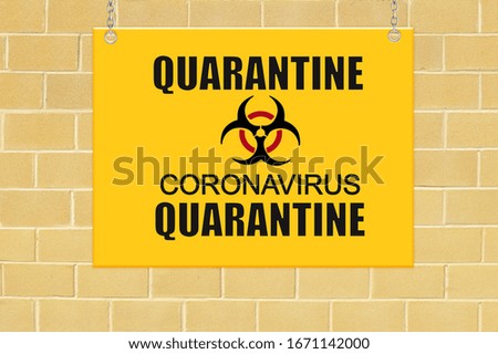 Quarantine Coronavirus sign on brick wall
