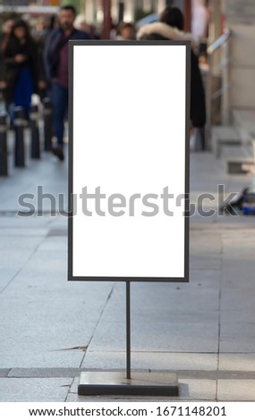 Blank poster sign with pole stand on the street.